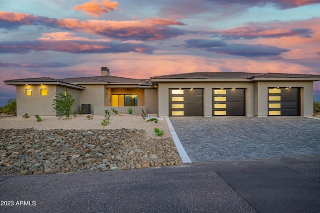 prairie-style home featuring a garage