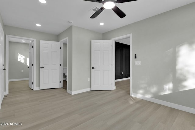 unfurnished bedroom featuring ceiling fan and light wood-type flooring