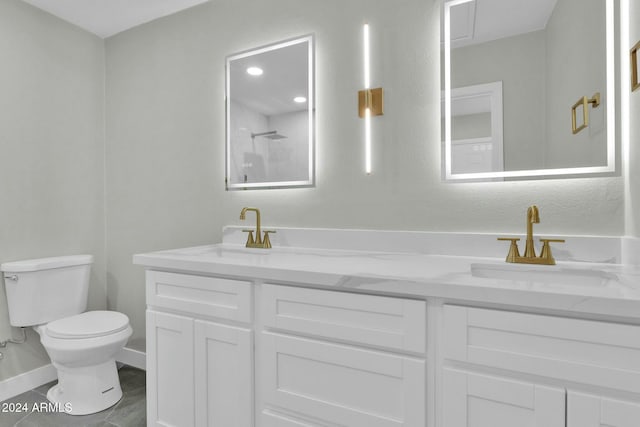 bathroom with walk in shower, tile patterned floors, vanity, and toilet