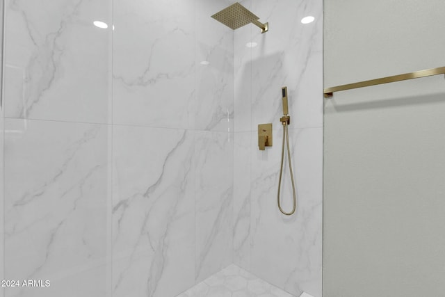 bathroom with a tile shower