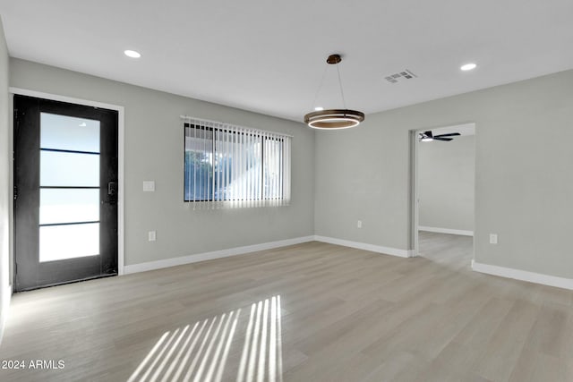 interior space featuring light hardwood / wood-style floors, ceiling fan, and a healthy amount of sunlight