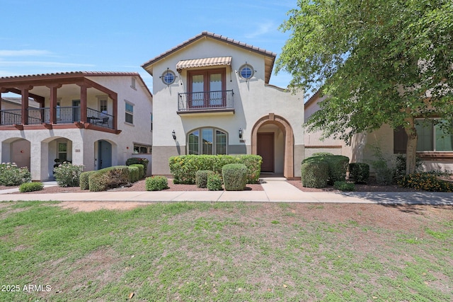 20545 W Terrace Ln, Buckeye, AZ 85396 - mediterranean / spanish home featuring a balcony, stucco siding, and a tiled roof