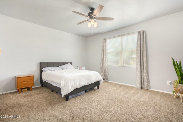 bedroom featuring ceiling fan and carpet floors