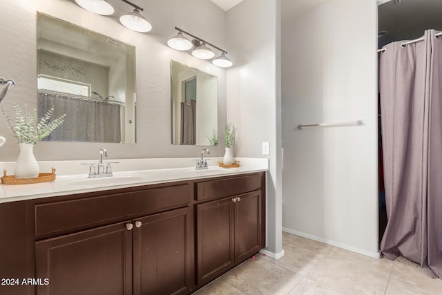 bathroom featuring tile patterned flooring and vanity