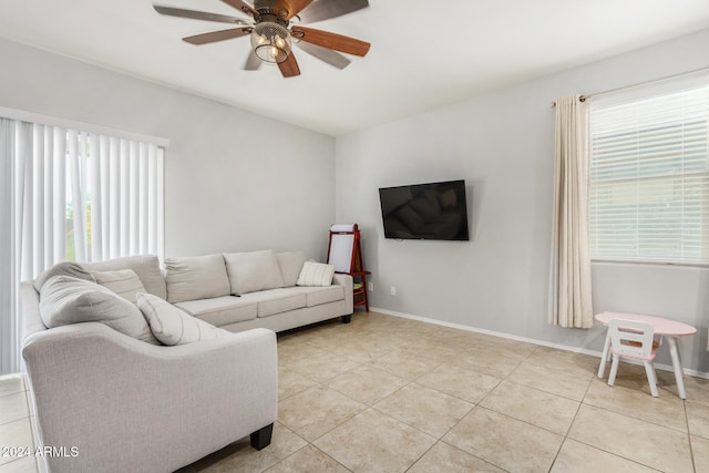 tiled living room with ceiling fan