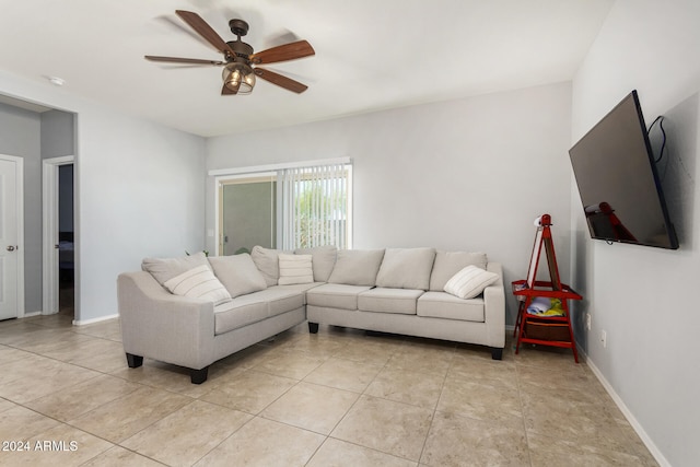 tiled living room with ceiling fan