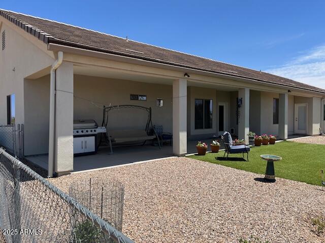 1067 N Jacobs Rd, Saint David, AZ 85630 - rear view of property with driveway, an attached carport, a patio area, and stucco siding