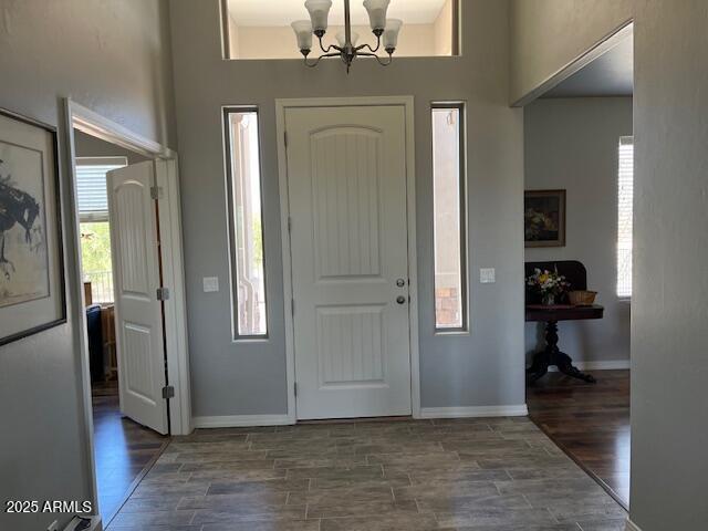1067 N Jacobs Rd, Saint David, AZ 85630 - entryway with a chandelier, wood finished floors, and baseboards