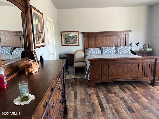 1067 N Jacobs Rd, Saint David, AZ 85630 - bedroom featuring dark wood-style floors