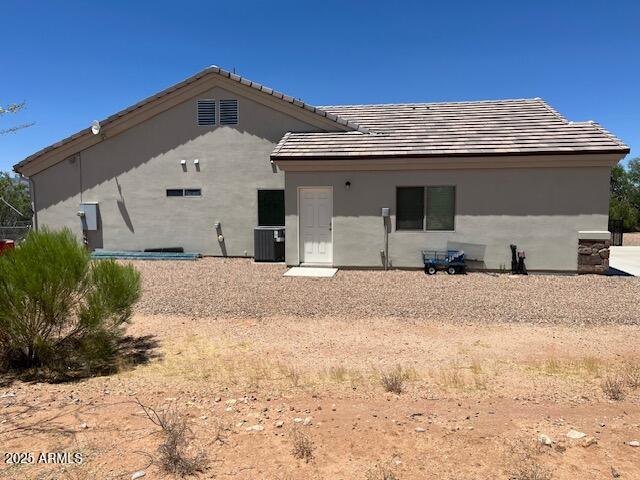 1067 N Jacobs Rd, Saint David, AZ 85630 - back of house with a tiled roof and stucco siding