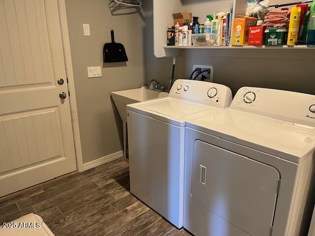 1067 N Jacobs Rd, Saint David, AZ 85630 - washroom featuring separate washer and dryer, dark wood-type flooring, and baseboards