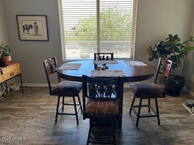1067 N Jacobs Rd, Saint David, AZ 85630 - dining space with baseboards and wood tiled floors