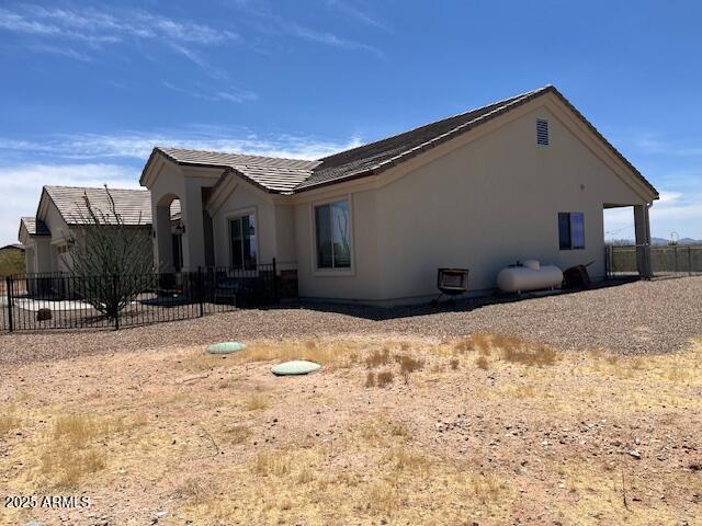 1067 N Jacobs Rd, Saint David, AZ 85630 - view of side of property with stucco siding and a patio