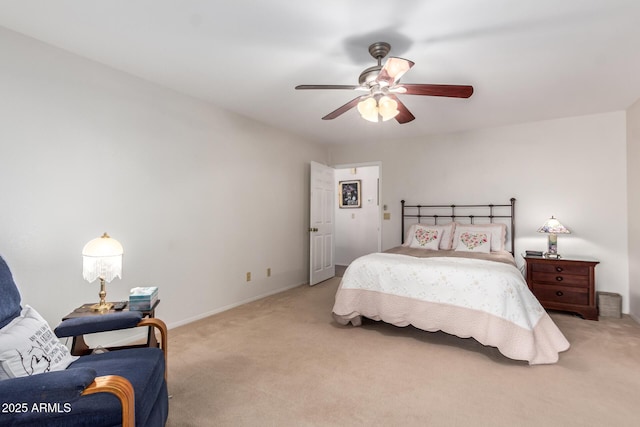 bedroom featuring light carpet, baseboards, and a ceiling fan