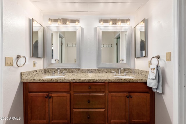 bathroom with double vanity and a sink