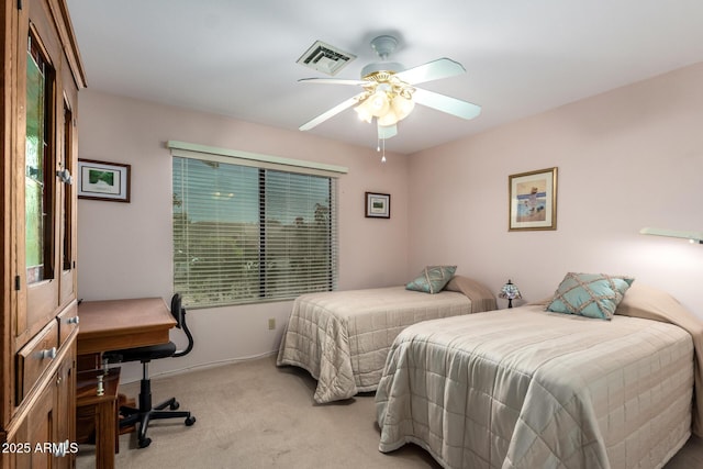 bedroom featuring ceiling fan, visible vents, and carpet