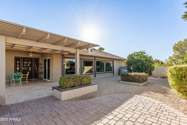 view of patio featuring fence and a pergola