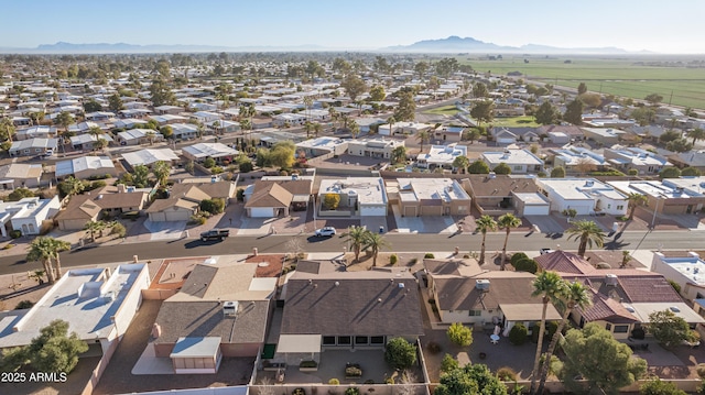 drone / aerial view featuring a residential view and a mountain view