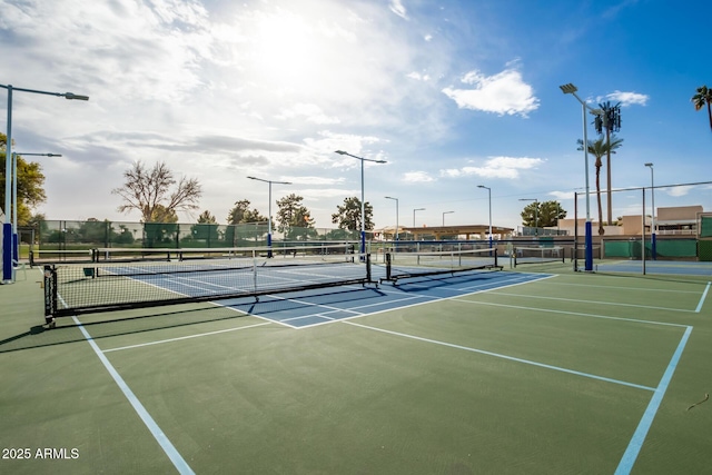 view of sport court with fence