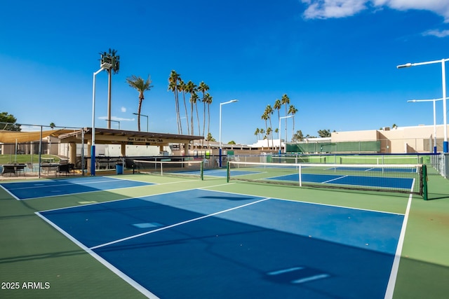 view of sport court featuring fence and community basketball court