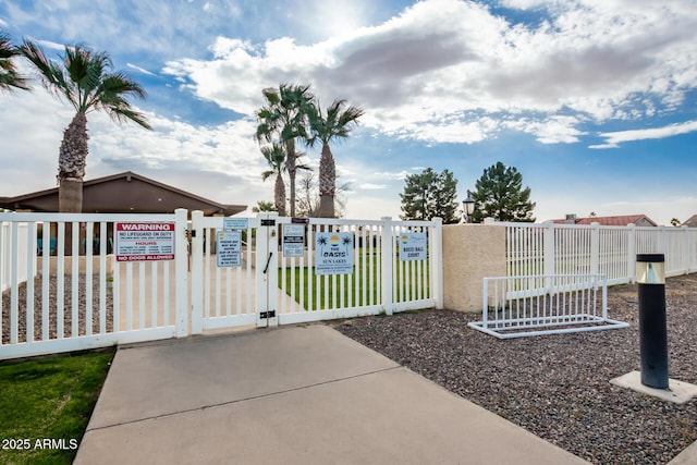view of gate with fence