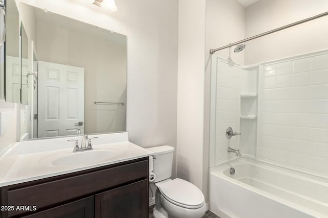 full bath featuring vanity, toilet, and shower / tub combination