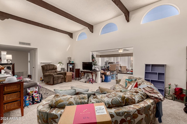 living room with light carpet, beamed ceiling, and ceiling fan