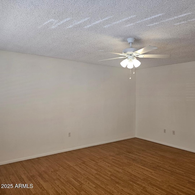 unfurnished room featuring a textured ceiling, ceiling fan, and dark hardwood / wood-style floors