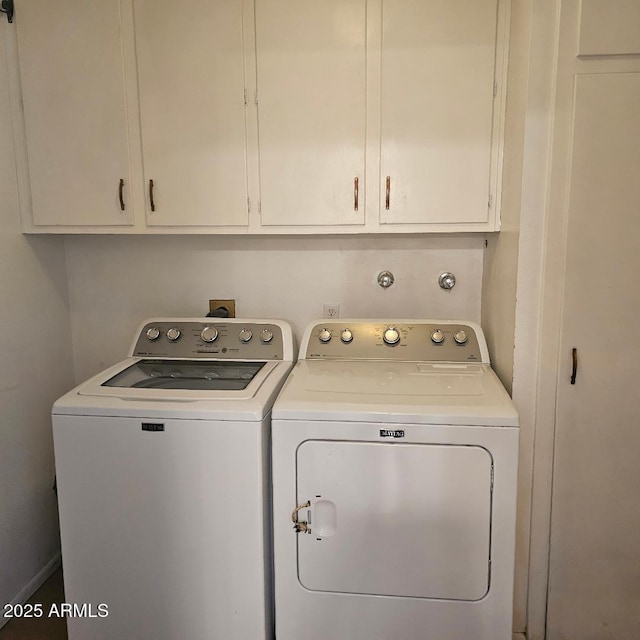 laundry room with cabinets and washer and dryer