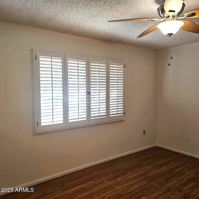 unfurnished room featuring ceiling fan, dark hardwood / wood-style floors, and a textured ceiling