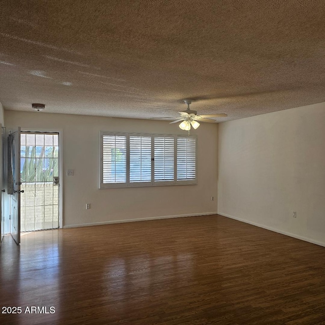 unfurnished room featuring a textured ceiling, dark hardwood / wood-style flooring, and ceiling fan