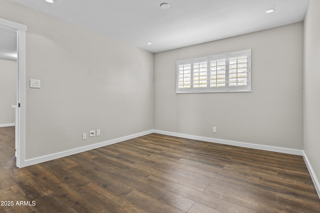 empty room with hardwood / wood-style flooring, recessed lighting, and baseboards