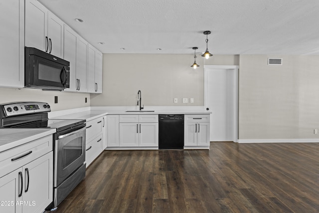 kitchen with black appliances, a sink, light countertops, white cabinets, and dark wood finished floors