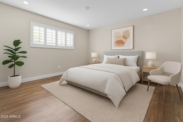 bedroom featuring wood finished floors, baseboards, and recessed lighting