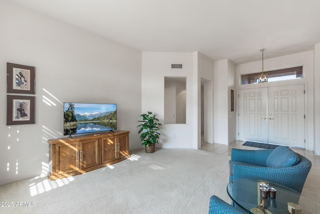 carpeted living room featuring visible vents