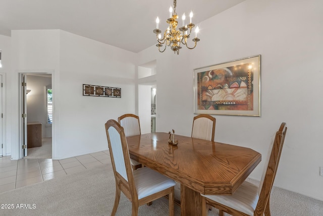 dining space featuring light tile patterned flooring, light carpet, and an inviting chandelier