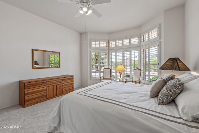 bedroom with ceiling fan and carpet floors