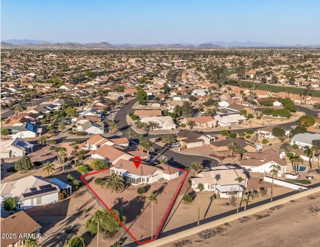 bird's eye view featuring a mountain view and a residential view