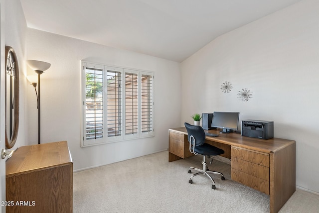 office with vaulted ceiling and carpet flooring