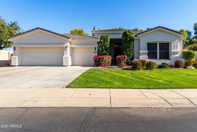 view of front facade featuring a garage and a front yard