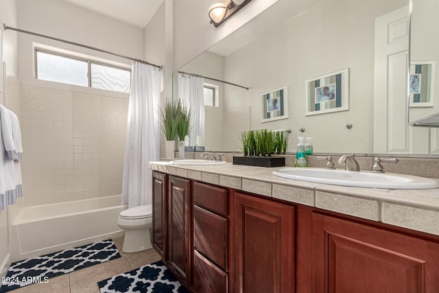 full bathroom featuring tile patterned flooring, vanity, toilet, and shower / tub combo with curtain