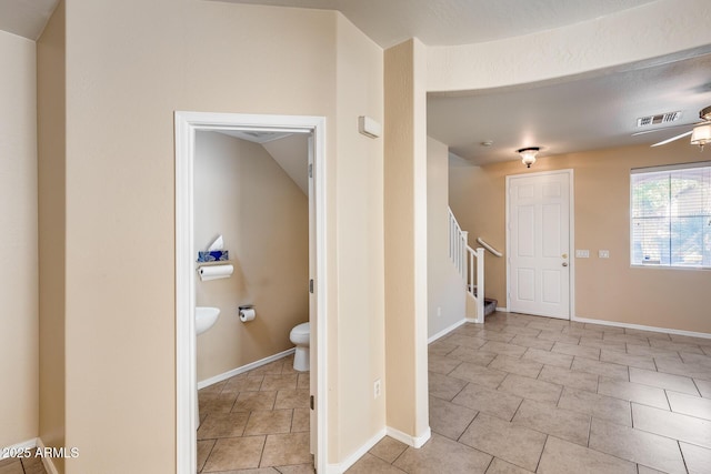 9 N 87th Ln N, Tolleson, AZ 85353 - foyer featuring stairs and baseboards
