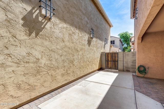 9 N 87th Ln N, Tolleson, AZ 85353 - view of patio with a gate