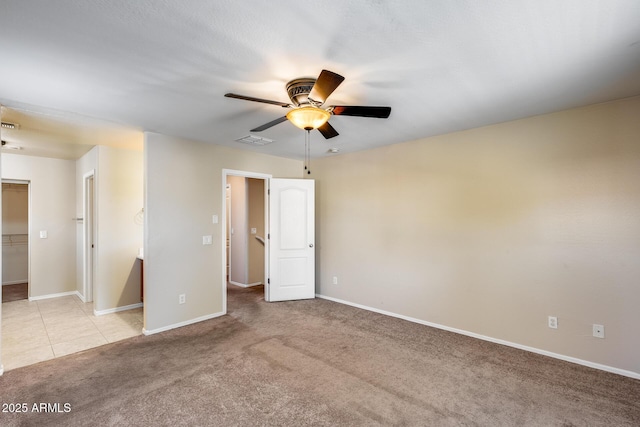 9 N 87th Ln N, Tolleson, AZ 85353 - empty room with ceiling fan, light carpet, and baseboards