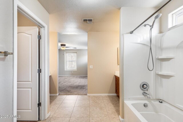 9 N 87th Ln N, Tolleson, AZ 85353 - full bath featuring shower / washtub combination, vanity, a ceiling fan, baseboards, and tile patterned flooring