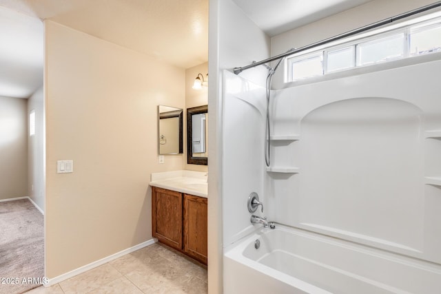 9 N 87th Ln N, Tolleson, AZ 85353 - full bath featuring bathing tub / shower combination, vanity, baseboards, and tile patterned floors