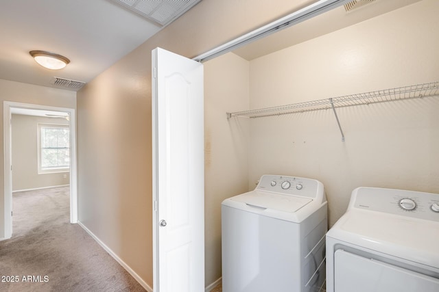 9 N 87th Ln N, Tolleson, AZ 85353 - washroom featuring washing machine and clothes dryer, light carpet, and baseboards