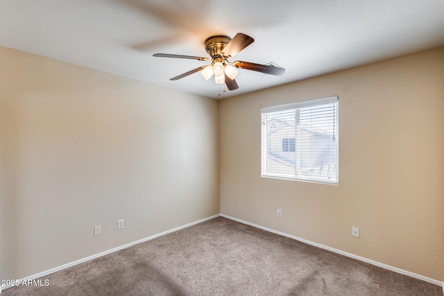 9 N 87th Ln N, Tolleson, AZ 85353 - carpeted spare room featuring baseboards and a ceiling fan