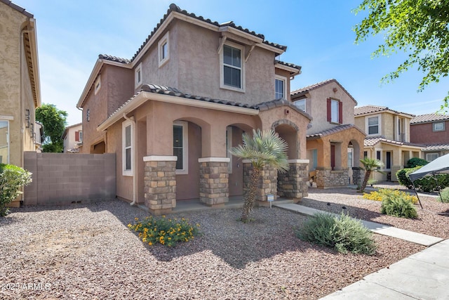 9 N 87th Ln N, Tolleson, AZ 85353 - view of front facade with a tile roof, stucco siding, and stone siding