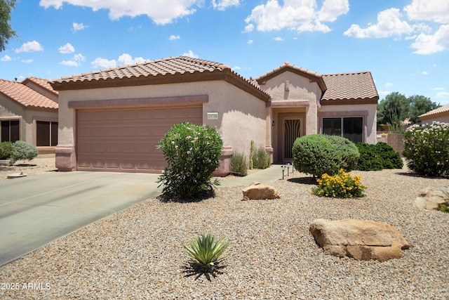 15790 W Arrowhead Dr, Surprise, AZ 85374 - mediterranean / spanish-style house featuring an attached garage, stucco siding, driveway, and a tiled roof
